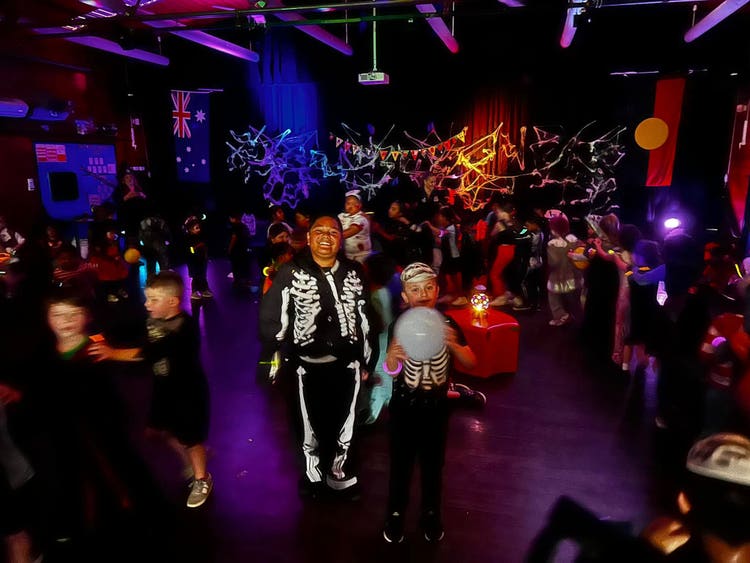 May be an image of dancing, lighting, accordion and crowd